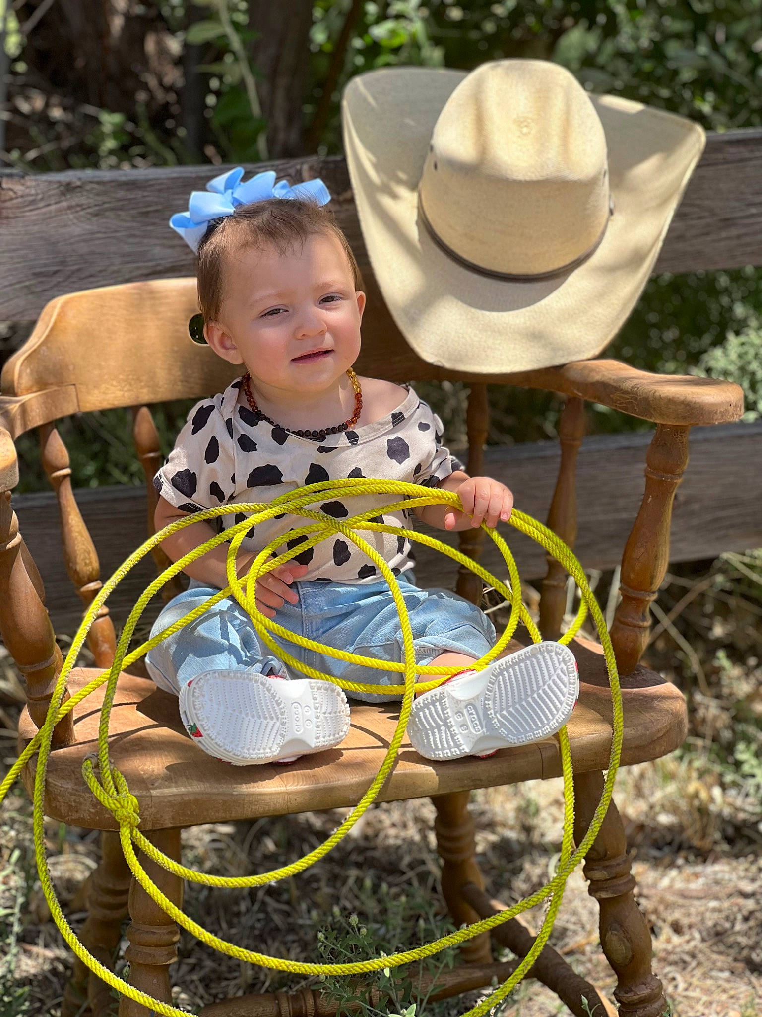 Delta joined the competition — help win amazing prizes! botany, chair, cowboy_hat, event, fashion_accessory, fedora, fun, grass, hat, joy, leisure, nature, person, plant, recreation, sitting, smile, sun_hat, table, toddler