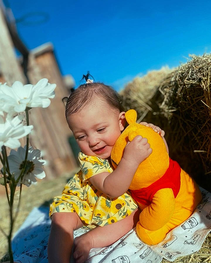 Delta joined the competition — help win amazing prizes! baby, child, eye, flash_photography, flower, fun, grass, happy, leisure, nature, people_in_nature, person, petal, plant, recreation, sitting, sky, t_shirt, toddler, travel