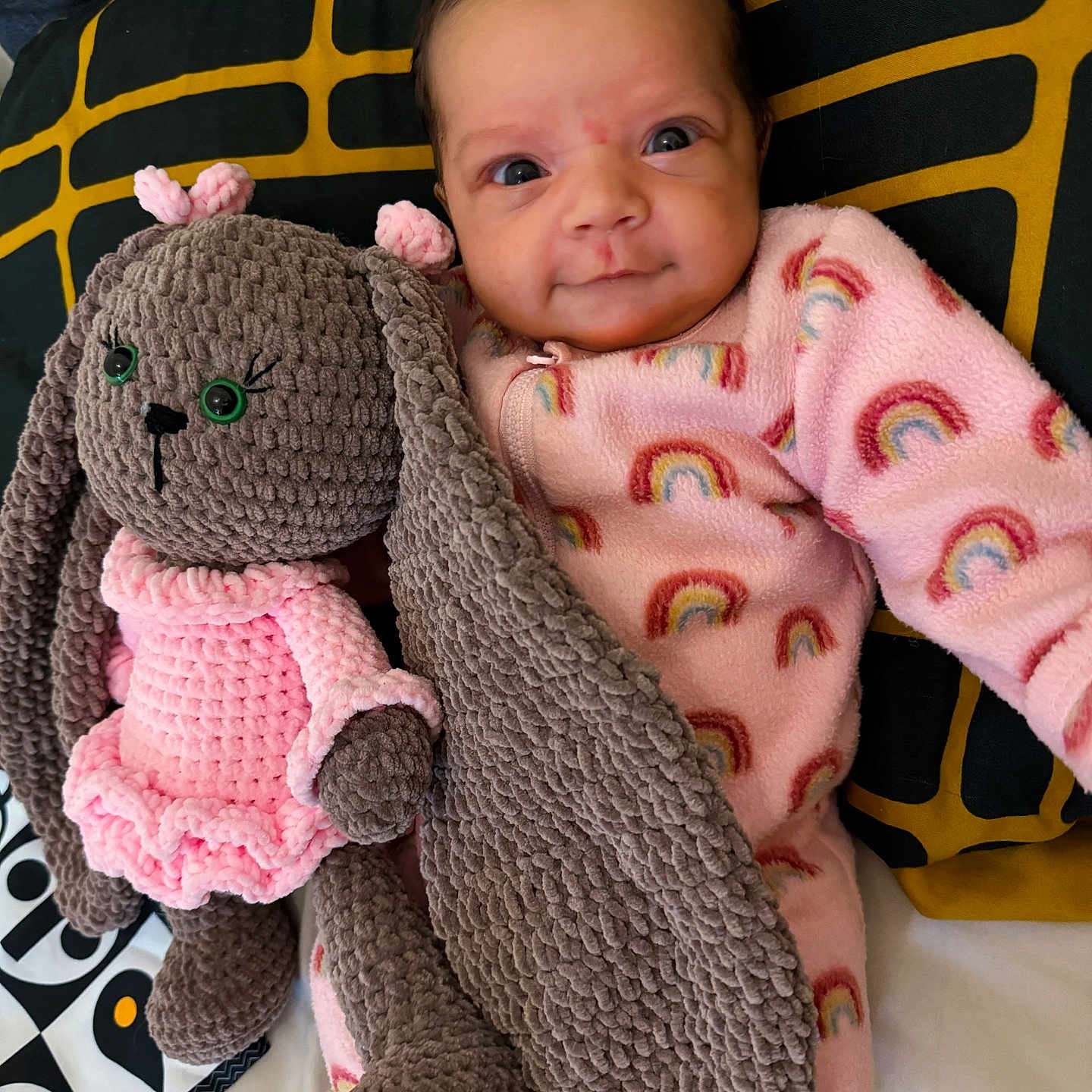 Amaya is registered to the contest to win money with this photo: baby, bed, blanket, clothing, couch, cushion, face, furniture, happy, head, homedecor, newborn, person, photography, pillow, portrait, quilt, sleeping, smile, toy