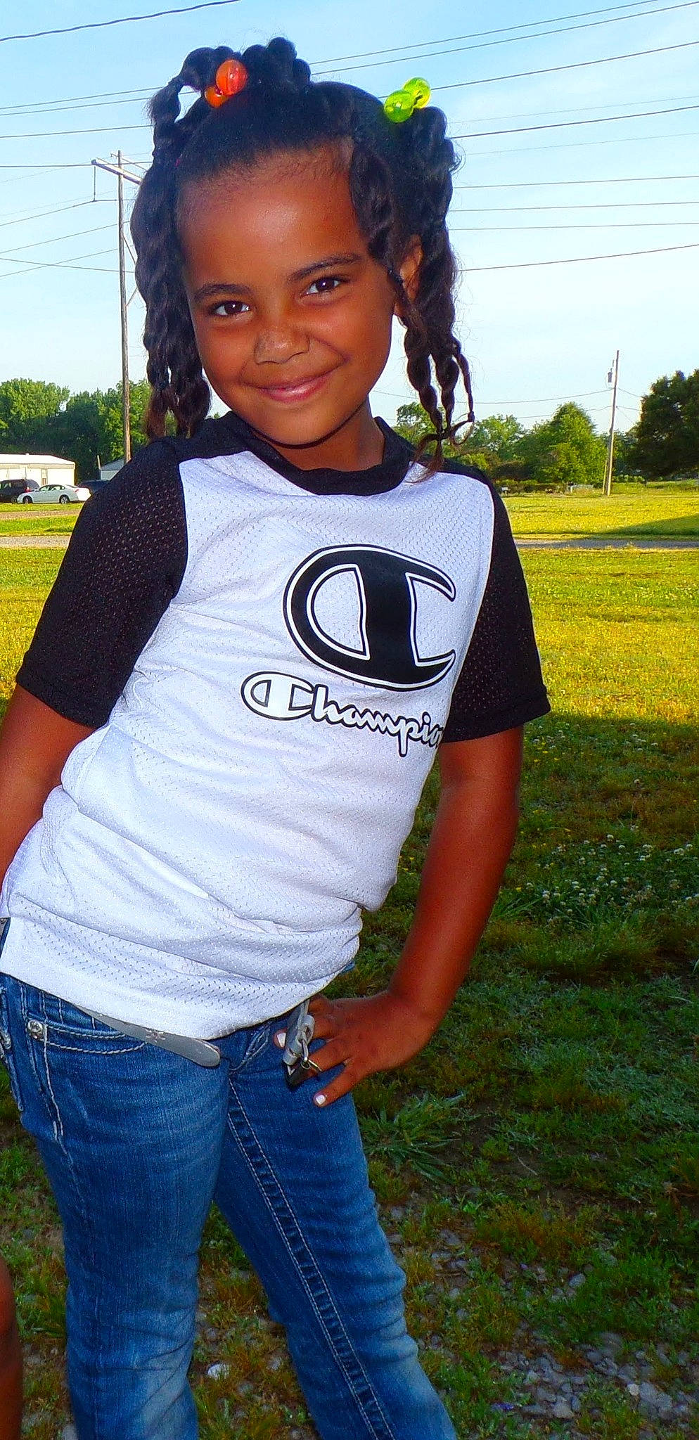 Isabella is registered to the contest to win money with this photo: black_hair, cool, electric_blue, fun, gesture, grass, happy, jeans, joy, leisure, lip, long_hair, neck, person, plant, sky, sleeve, smile, t_shirt, tree