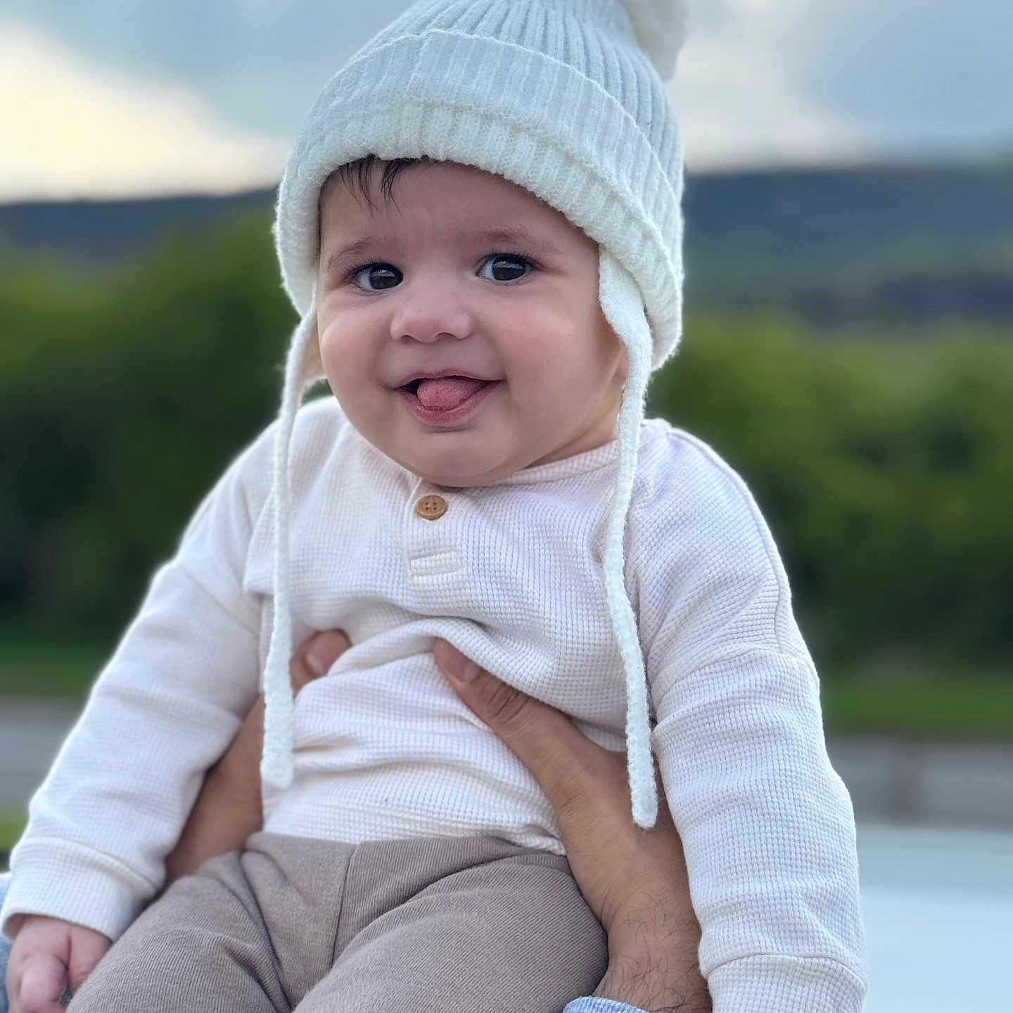 Fatehveer Singh is registered to the contest to win money with this photo: baby, beanie, bonnet, cap, clothing, coat, face, happy, hat, head, jacket, jeans, knitwear, pants, person, photography, portrait, sitting, smile, sweater