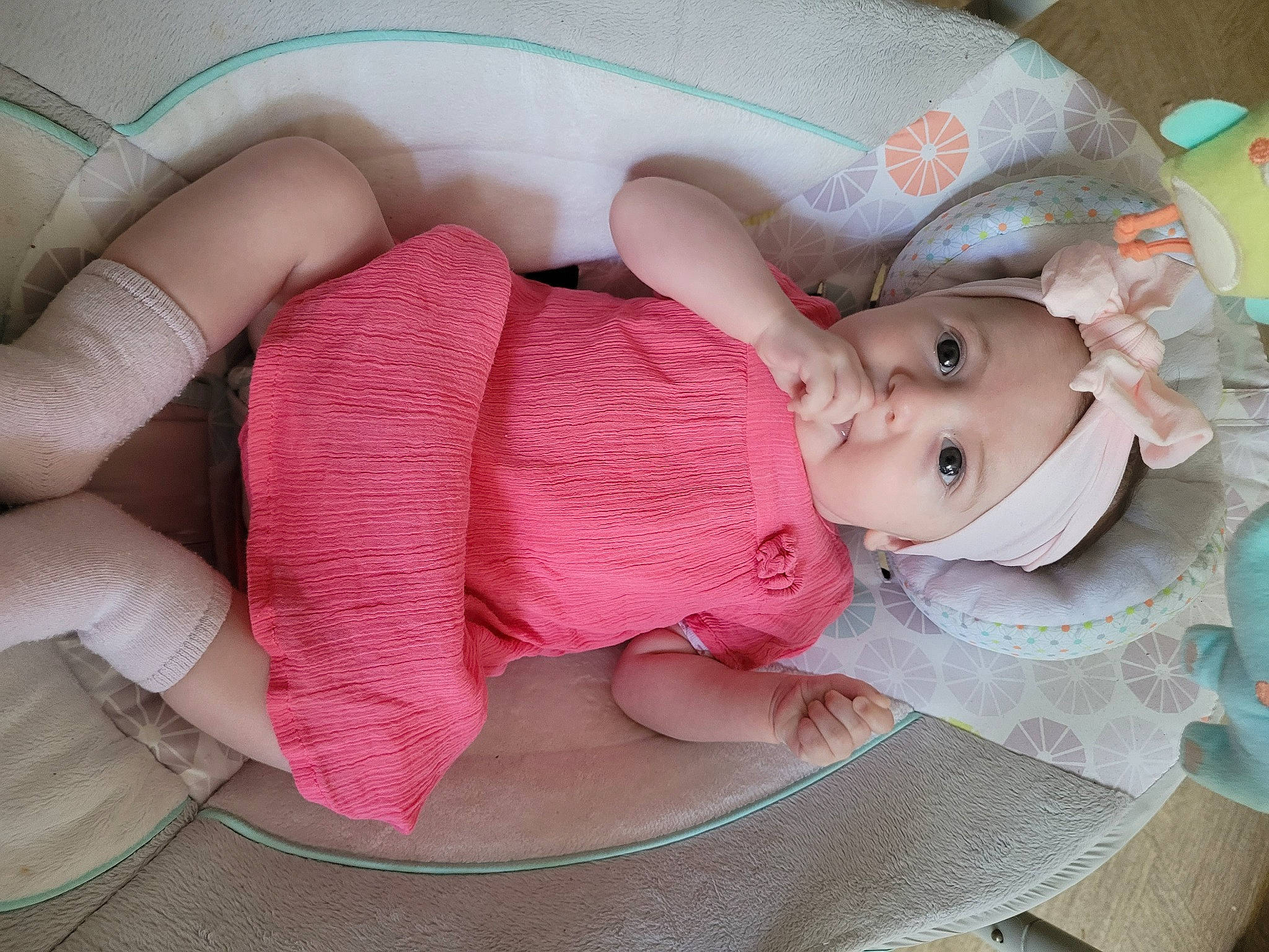 Myla participe au concours pour gagner de l'argent avec cette photo : baby, baby_carriage, baby_products, baby_toddler_clothing, cheek, child, comfort, fashion_accessory, finger, headgear, headwear, human_body, lip, mouth, nail, pattern, person, pink, skin, smile