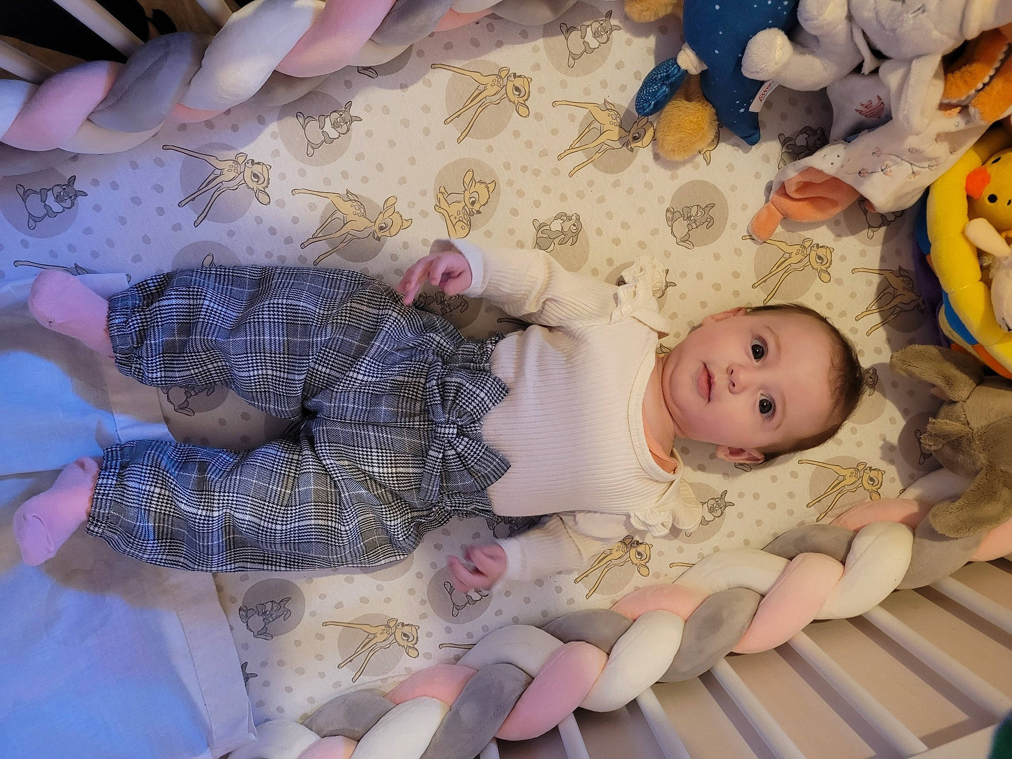 Myla participe au concours pour gagner de l'argent avec cette photo : baby, baby_products, baby_toddler_clothing, baby_toys, cheek, child, comfort, finger, flooring, linens, nail, pattern, person, pink, room, skin, textile, toddler, toy, white