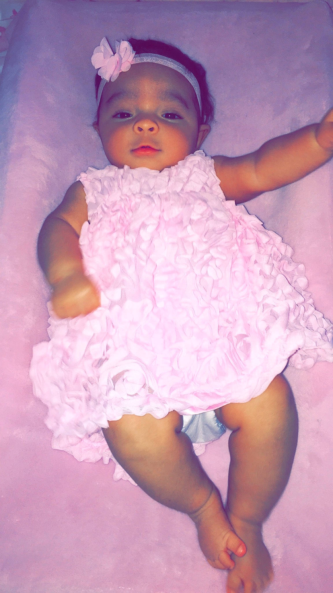 Marina is registered to the contest to win money with this photo: baby, baby_toddler_clothing, cheek, child, fun, hair_accessory, person, pink, product, purple, skin, smile, textile, toddler