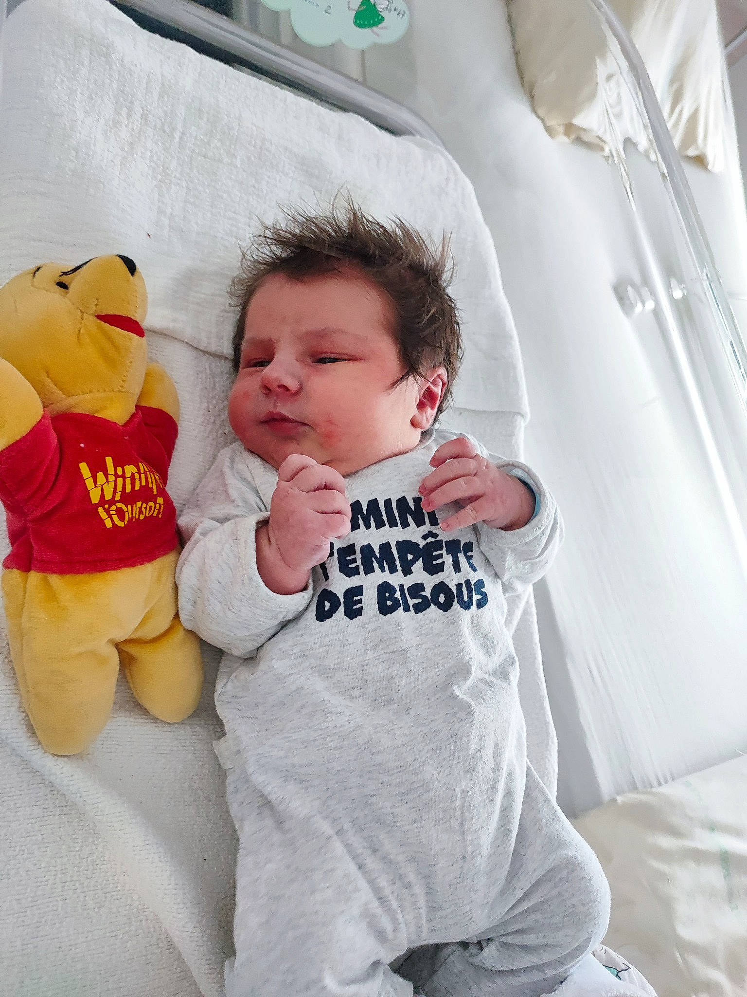 Kayden participe au concours pour gagner de l'argent avec cette photo : baby, baby_products, baby_sleeping, baby_toddler_clothing, bedding, child, comfort, finger, fun, happy, linens, person, product, sitting, sleeve, stuffed_toy, t_shirt, textile, toddler, toy