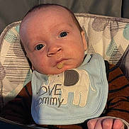 Jacob is registered to the contest to win money with this photo: baby, infant, bib, elephant, drool, face, blue_eyes, cushion, clothing, cute, child, expression, indoor, person, portrait, seat, striped, young, newborn, love_mommy