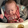 Jacob joined the competition — help win amazing prizes! baby, high_chair, bib, baby_food, spoon, feeding, infant, cute, child, mealtime, pink, clothing, food_jar, hand, table, indoor, person, face, expression, seat