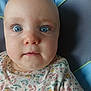 Ashley a rejoint le concours — aidez-le/la à gagner de superbes lots ! baby, blue_eyes, closeup, curious, floral_shirt, infant, face, head, child, sitting, portrait, indoors, seat, clothing, person, skin, eyelashes, cute, young, expression