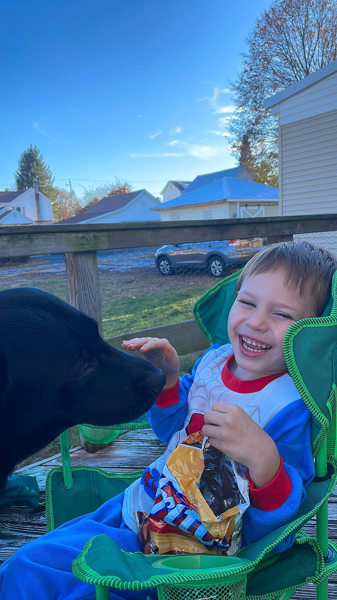 Alexander is registered to the contest to win money with this photo: car, cloud, electric_blue, event, family_car, fun, grass, grassland, happy, joy, landscape, leisure, person, plant, recreation, sitting, sky, smile, toddler, travel
