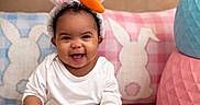 Khalaya joined the competition — help win amazing prizes! baby, bunny_ears, carrot, celebration, child, colorful_eggs, easter, easter_eggs, happy, headband, indoor, infant, pajamas, pillows, playroom, portrait, sitting, smiling, stuffed_decorations, white_clothing