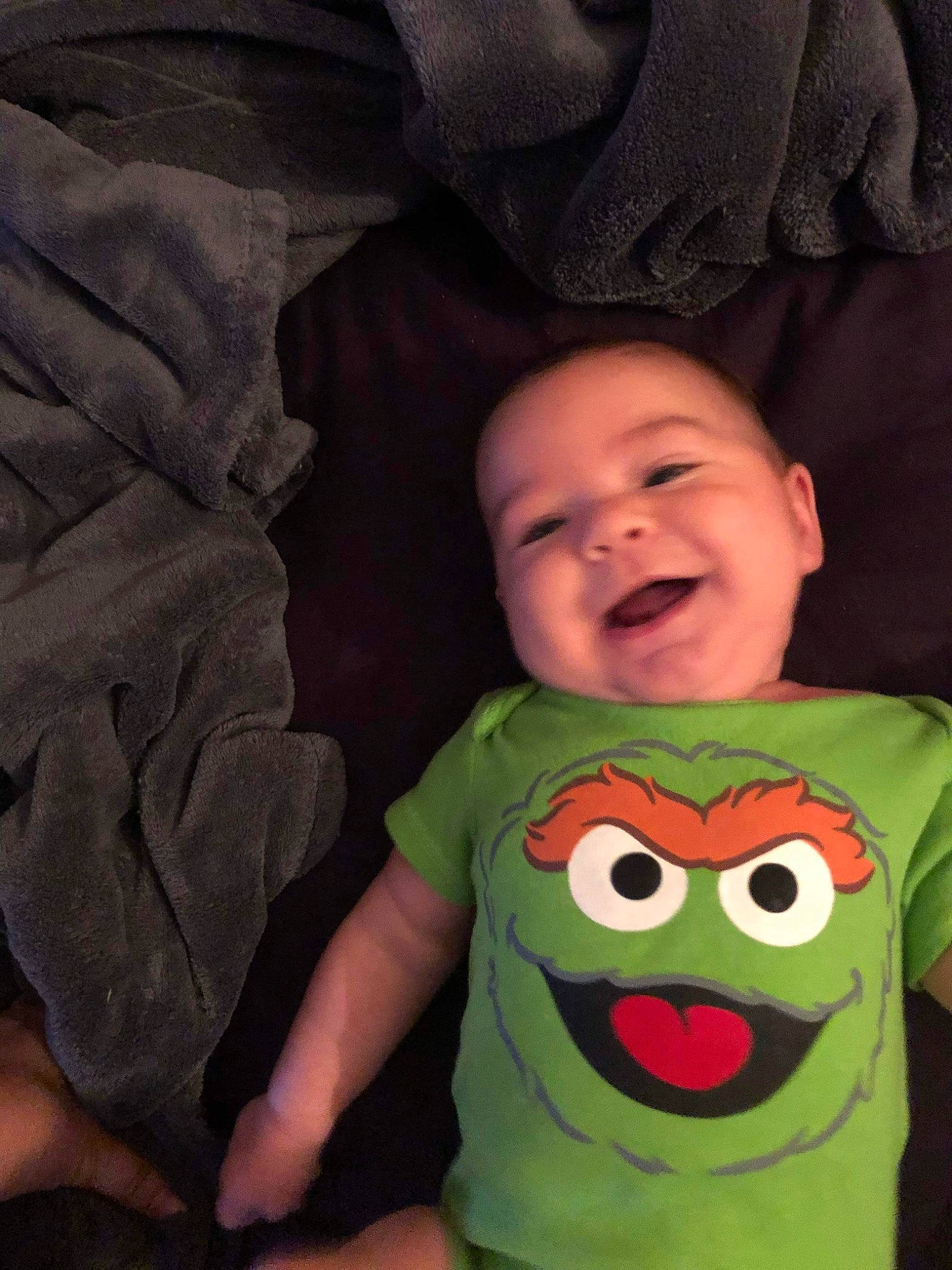 Jimmy is registered to the contest to win money with this photo: baby, baby_toddler_clothing, cheek, child, chin, comfort, cool, finger, gesture, happy, head, mouth, person, skin, sleeve, smile, t_shirt, textile, thumb, toddler