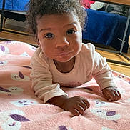 Pereira Luisa participe au concours pour gagner de l'argent avec cette photo : baby, bedroom, blanket, clothing, cozy, curly_hair, eyes, face, floor, hands, indoor, infant, pink_blanket, playtime, plush_toy, portrait, stuffed_animal, teddy_bear, toddler, toy_shelf