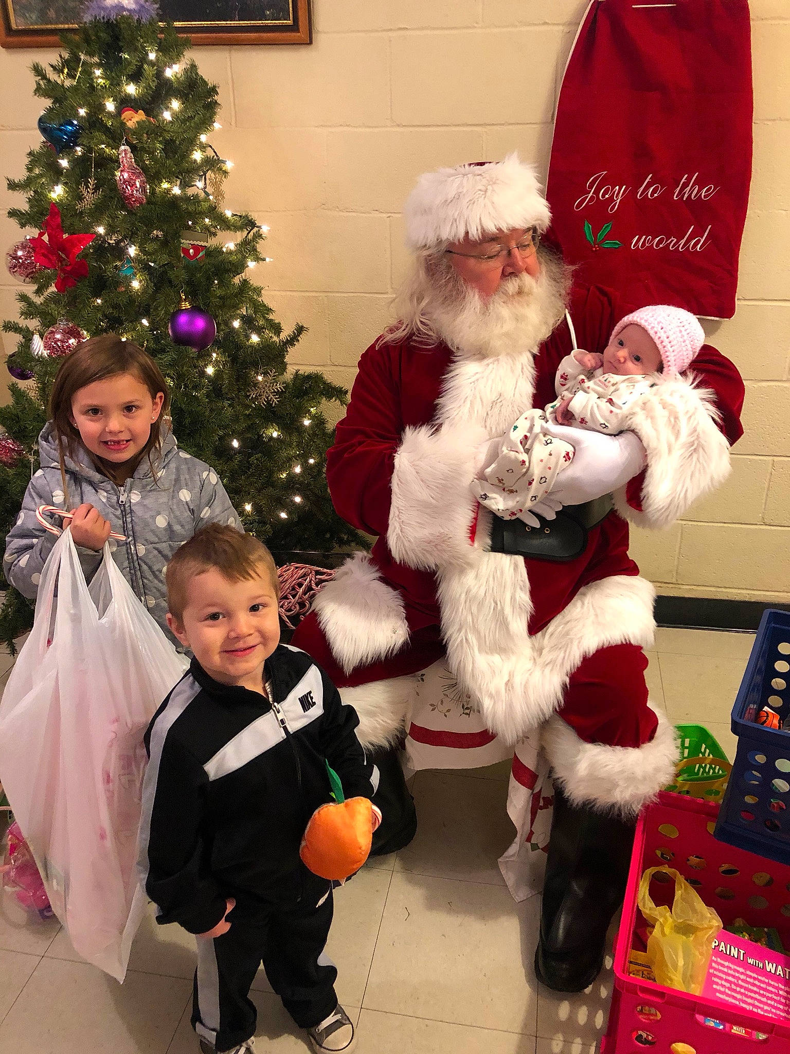 Sophia joined the competition — help win amazing prizes! child, christmas, christmas_decoration, christmas_eve, christmas_ornament, christmas_tree, event, fictional_character, headwear, holiday, human_body, joy, lap, person, santa_claus