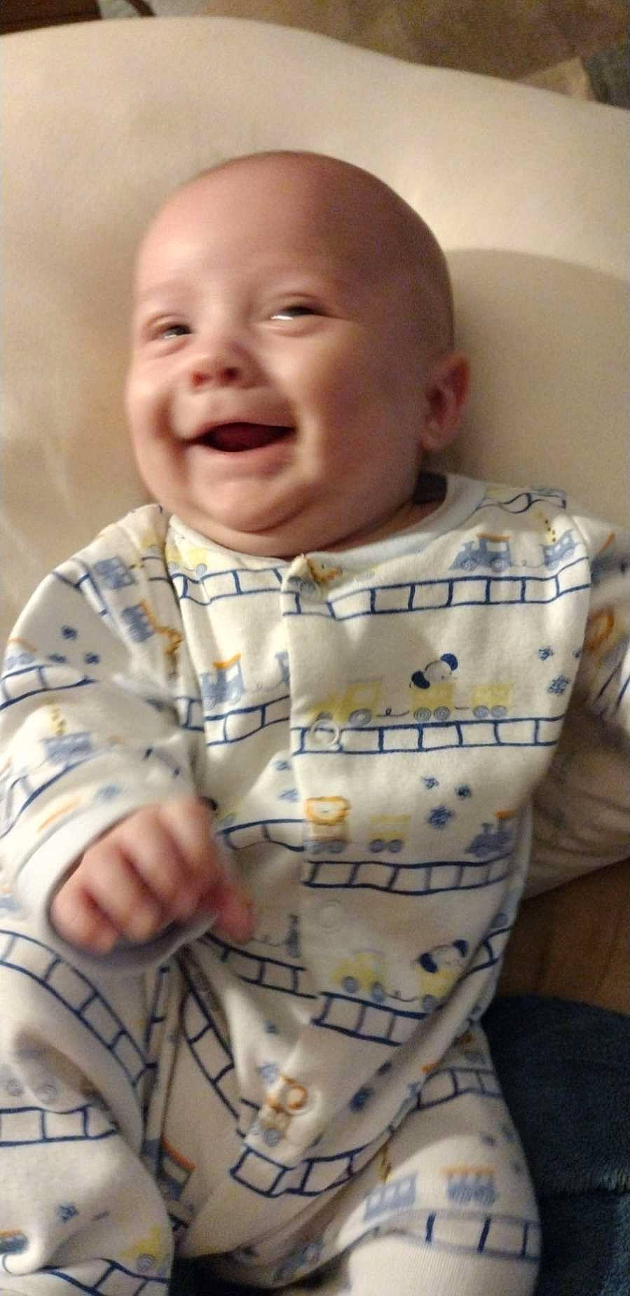 Hunter is registered to the contest to win money with this photo: arm, baby, baby_toddler_clothing, cheek, eye, eyebrow, face, forehead, head, human, human_body, joy, lip, mouth, neck, nose, organ, outerwear, person, skin