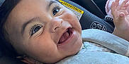 Arliss Selah is registered to the contest to win money with this photo: baby, child, car_seat, smile, happy, infant, clothing, seatbelt, closeup, portrait, indoor, cute, young_child, face, eyes, human, skin, sitting, baby_girl, toddler