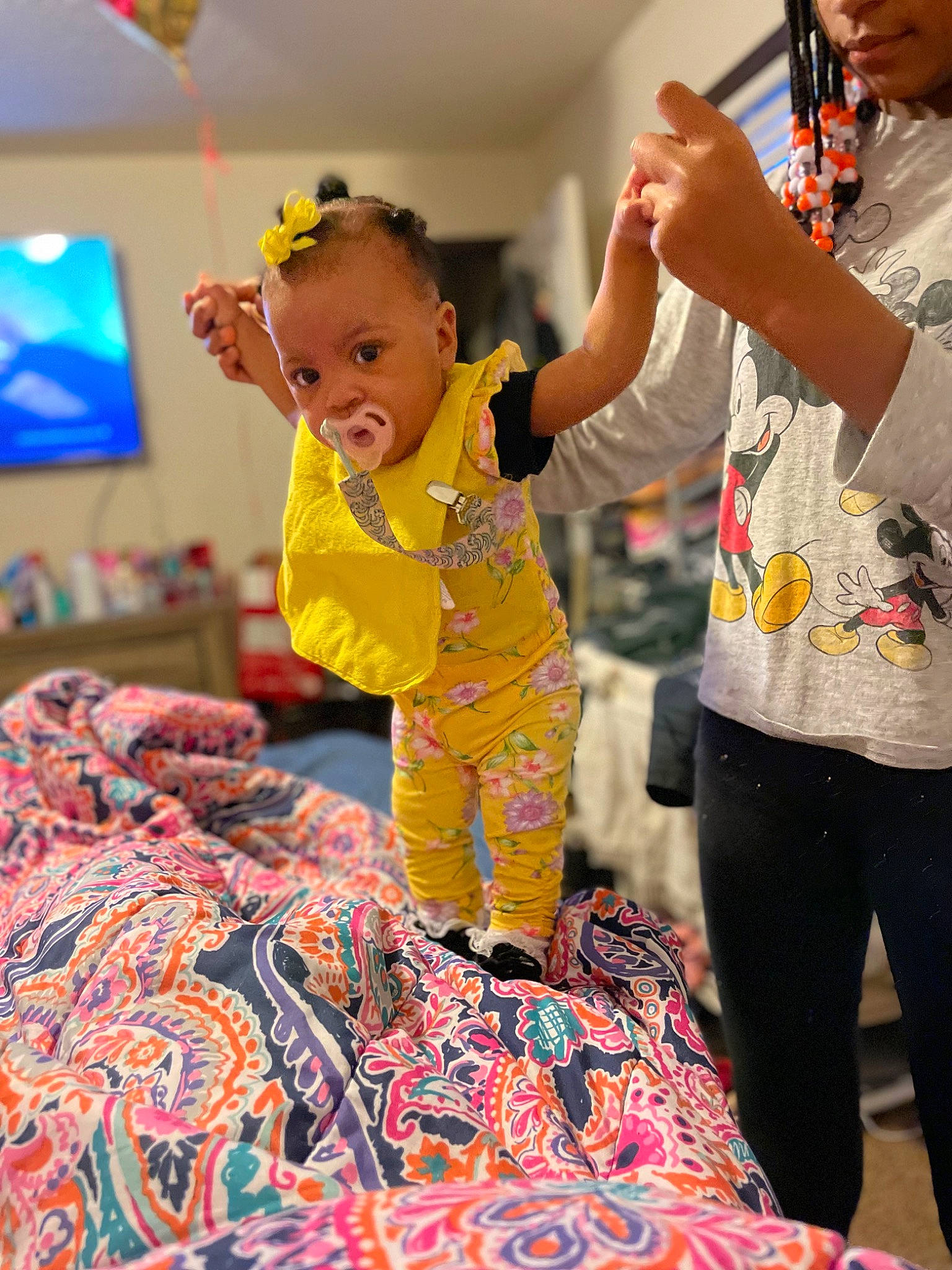 Lola is registered to the contest to win money with this photo: baby, child, design, event, flooring, fun, gesture, happy, leisure, linens, magenta, pattern, person, picture_frame, play, red, room, smile, t_shirt, television