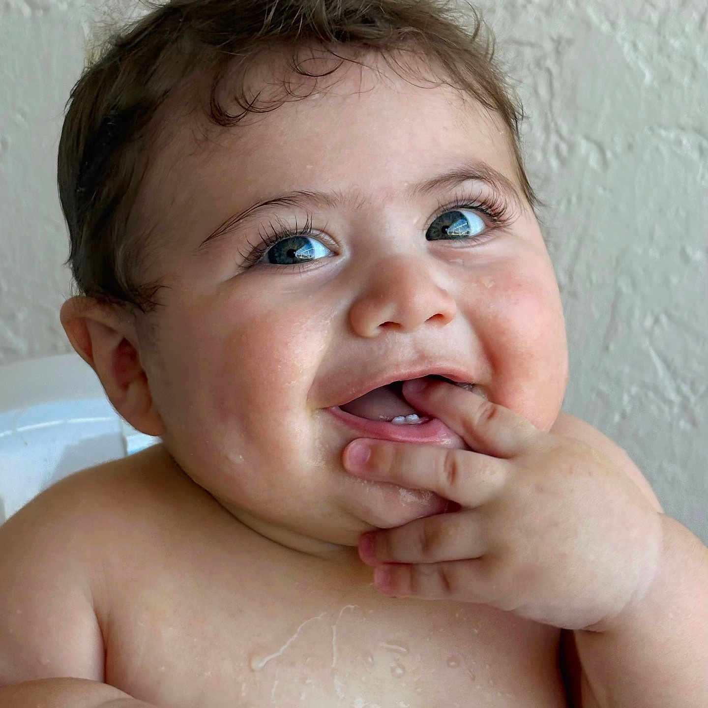 Damian is registered to the contest to win money with this photo: baby, child, smiling, face, hands, fingers, cheeks, eyes, skin, expression, happy, cute, portrait, infant, closeup, person, texture, background, chubby, joyful