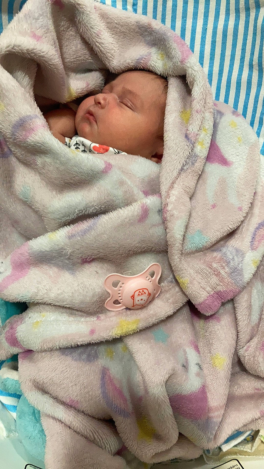 Amora is registered to the contest to win money with this photo: art, baby, baby_products, baby_sleeping, baby_toddler_clothing, bedding, bedtime, child, comfort, finger, linens, nail, pattern, person, pink, skin, sleeve, textile, toddler, wool