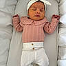 newborn, baby, sleeping, headband, pink_clothing, white_pants, lace, cushion, bedding, infant, peaceful, cute, resting, indoors, portrait, person, soft, child, sleep, cozy