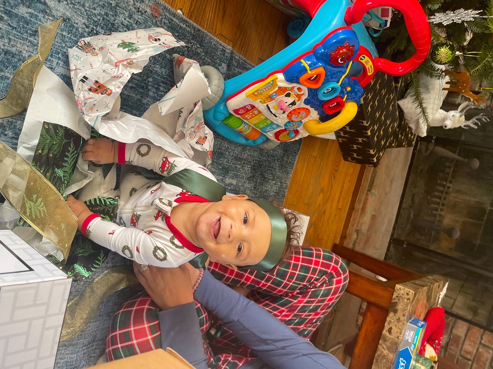 Chasen is registered to the contest to win money with this photo: art, box, carmine, costume, event, fun, headwear, human_leg, joy, leisure, pattern, person, plaid, plastic, retail, room, tartan, textile, thigh, tree