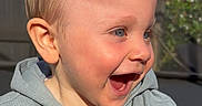 Jamie joined the competition — help win amazing prizes! toddler, child, laughing, happy, blue_eyes, hoodie, outdoor, sunlight, face, skin, head, person, expression, joy, casual_clothing, portrait, smile, cheeks, baby, young_child