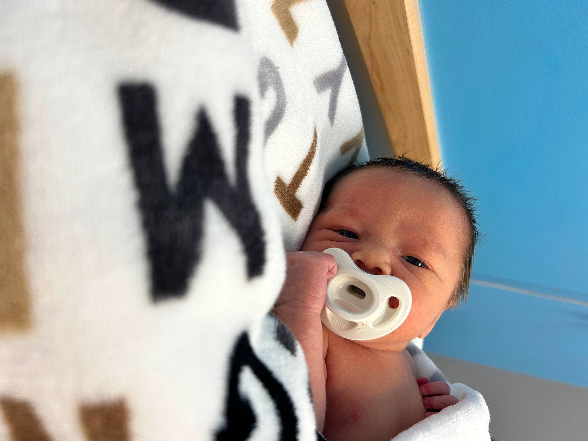 Anthony is registered to the contest to win money with this photo: audio_equipment, baby, baby_products, baby_toddler_clothing, carmine, cheek, child, chin, comfort, eye, eyelash, font, fun, happy, linens, moustache, nose, person, room, thumb