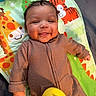 Julien joined the competition — help win amazing prizes! baby, child, smiling, playmat, giraffe, tiger, toy, brown_onesie, infant, cute, happy, indoors, lying_down, colorful, soft_toys, hand, face, head, expression, young_child