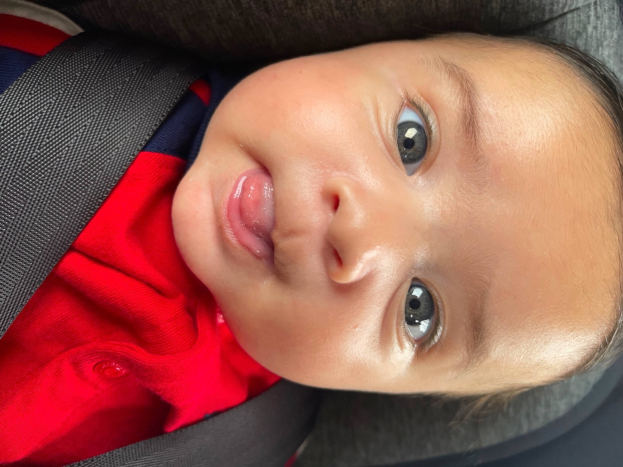 Max is registered to the contest to win money with this photo: baby, cheek, child, chin, close_up, ear, eyebrow, eyelash, face, forehead, fun, human_body, iris, lip, mouth, neck, nose, person, skin, toddler