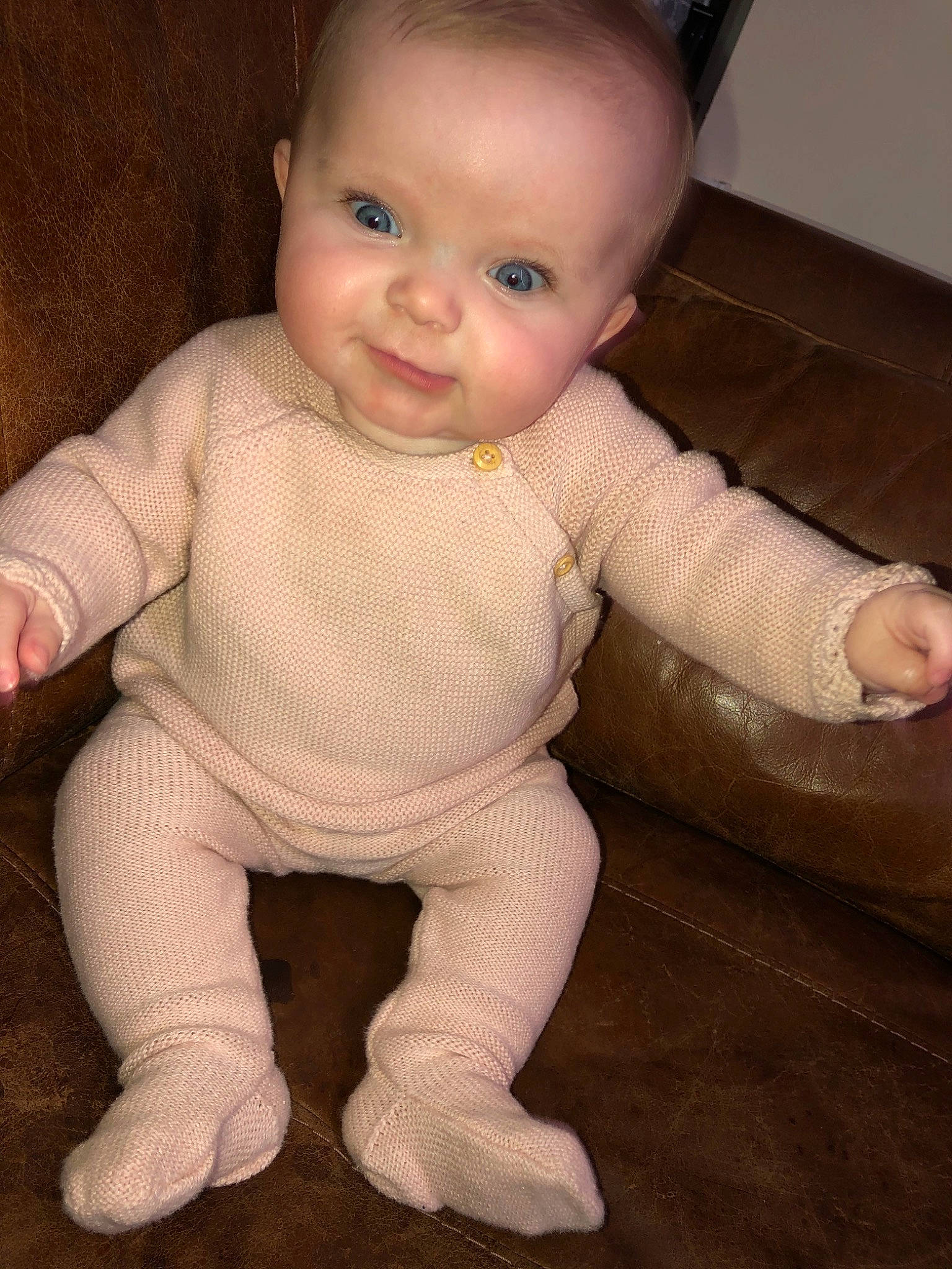 Iyla is registered to the contest to win money with this photo: baby, baby_toddler_clothing, cheek, child, crawling, face, finger, head, lip, mouth, nose, person, sitting, skin, smile, toddler