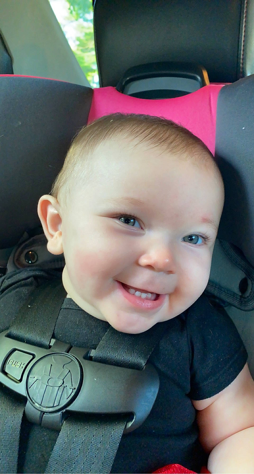 Calliope is registered to the contest to win money with this photo: baby, baby_carriage, cheek, chin, eye, eyebrow, face, facial_expression, finger, green, happy, head, iris, joy, lip, mouth, nose, person, seat_belt, skin