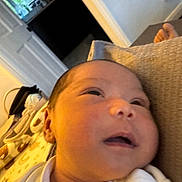 Avery is registered to the contest to win money with this photo: baby, newborn, infant, face, cushion, blanket, indoor, closeup, cozy, resting, soft, person, sleepy, head, skin, clothing, home, newborn_baby, portrait, child