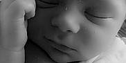 Louis participe au concours pour gagner de l'argent avec cette photo : newborn, baby, sleeping, black_and_white, blanket, infant, peaceful, closeup, face, hand, soft, wrapped, portrait, resting, cute, skin, cozy, calm, child, tender