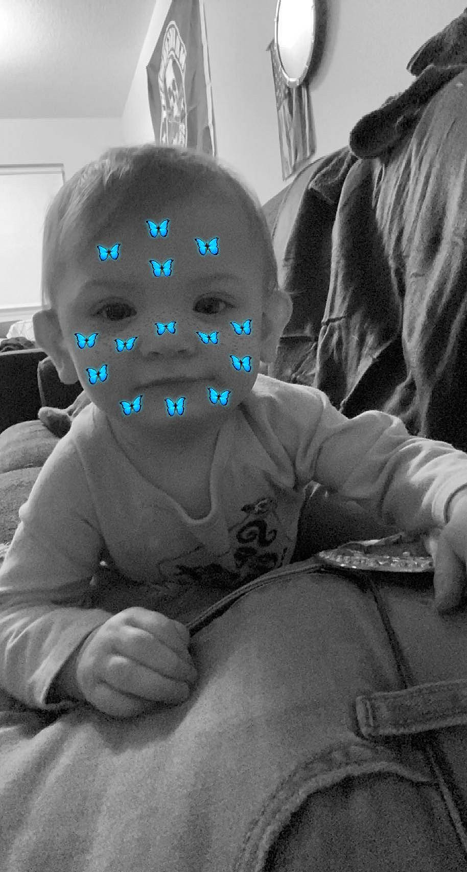 Dixie is registered to the contest to win money with this photo: art, comfort, costume, electric_blue, eye, fictional_character, fun, grey, mask, monochrome, monochrome_photography, person, personal_protective_equipment, room, sitting, skull, sleeve, sports_gear, style, toddler