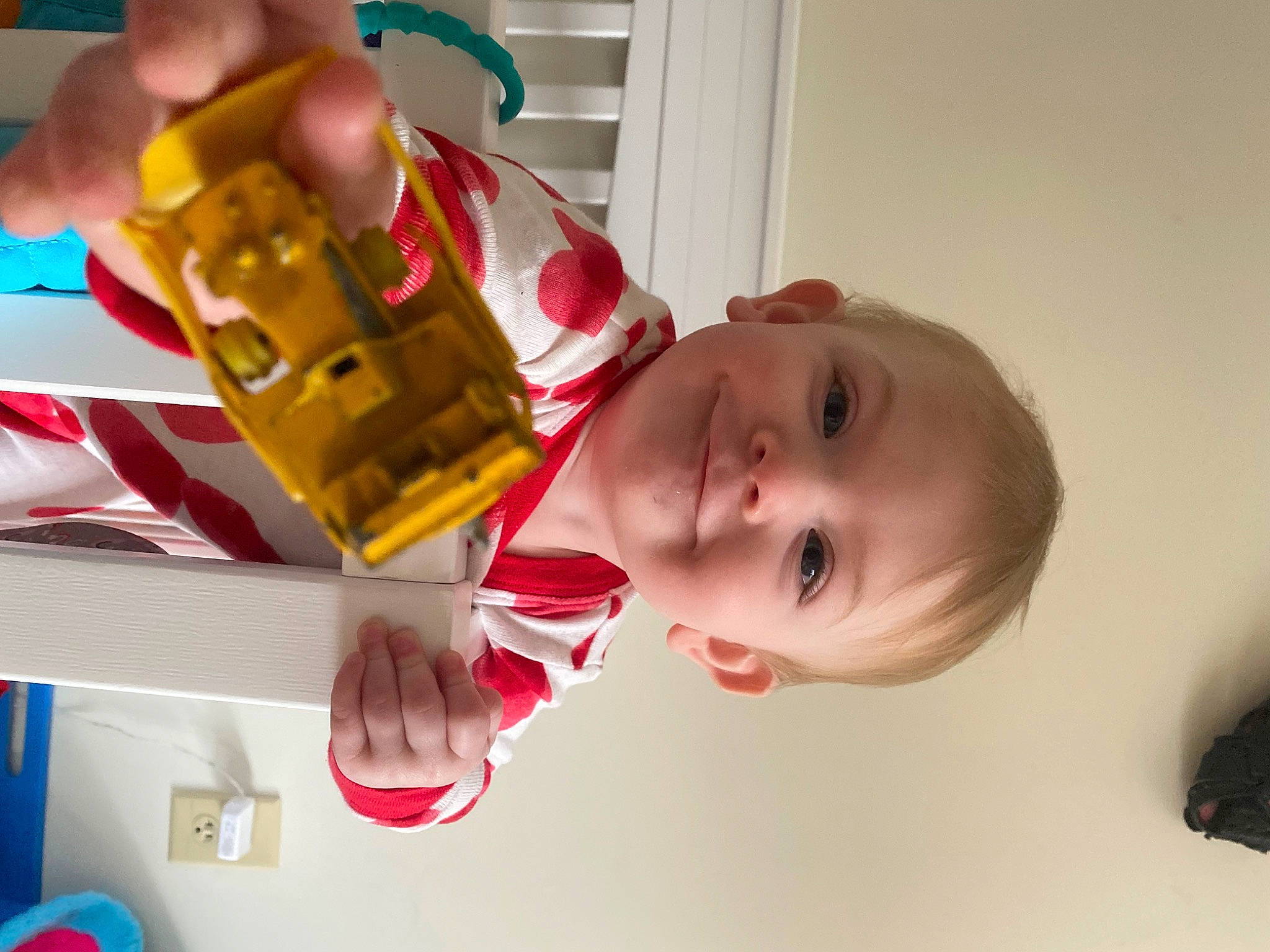Dixie May is registered to the contest to win money with this photo: baby, baby_products, baby_toddler_clothing, baby_toys, child, finger, fun, hand, happy, joy, person, play, product, red, room, smile, toddler, toy, wood