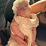 Brianna joined the competition — help win amazing prizes! baby, sleeping, pacifier, lace_dress, flower_headband, infant, child, arm, hand, adult, holding, indoor, soft_light, peaceful, cute, person, closeup, portrait, fabric, delicate