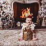 Brianna joined the competition — help win amazing prizes! baby, child, gift_box, christmas_decorations, fireplace, holiday, festive, reindeer_headband, lace_dress, carpet, smiling, indoor, christmas_tree, nutcracker, wood_floor, decorative_lights, holiday_season, cozy, winter, smile