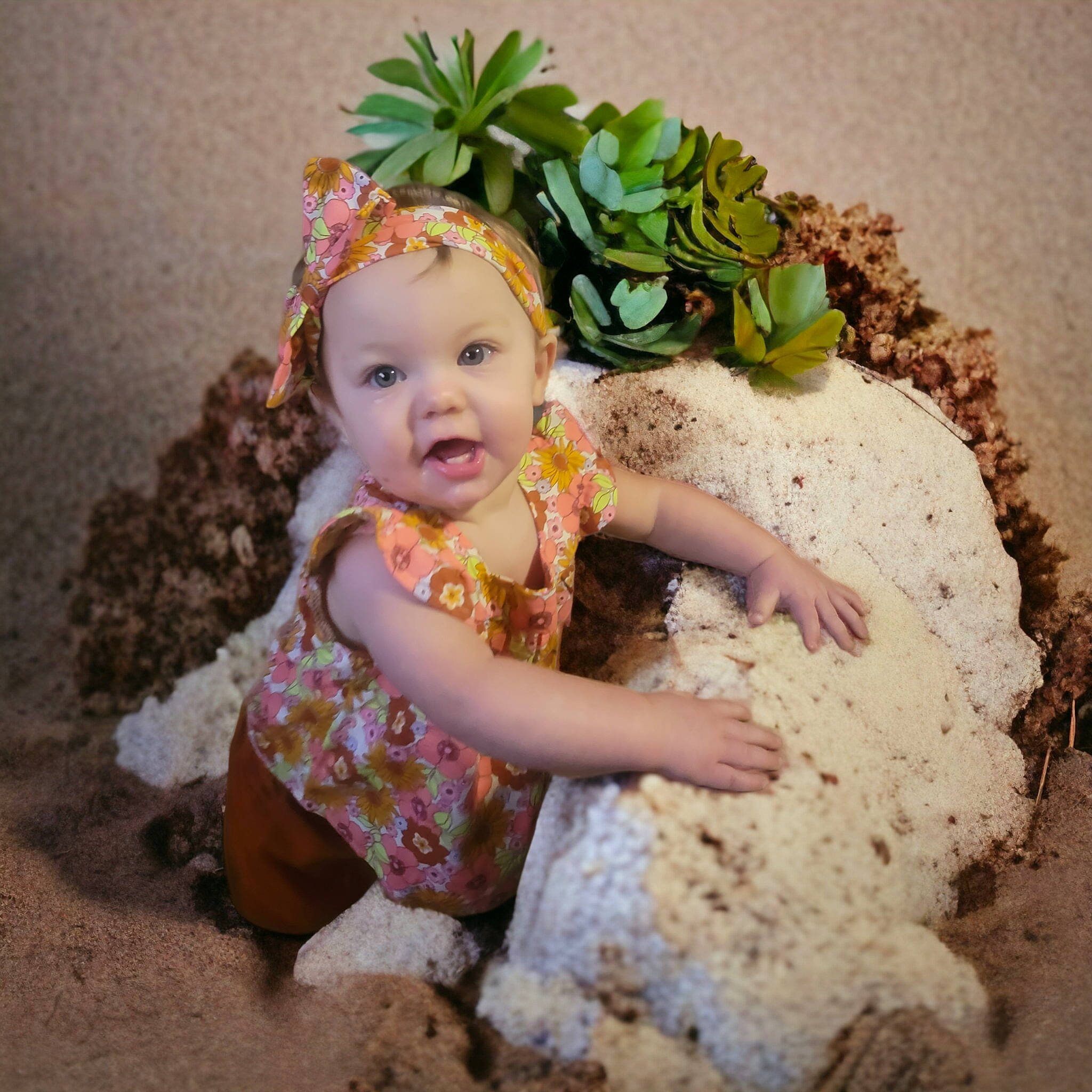Salem is registered to the contest to win money with this photo: baby, baby_toddler_clothing, child, cut_flowers, fashion_accessory, floral_design, flower, flower_arranging, fun, grass, happy, headpiece, headwear, people_in_nature, person, petal, pink, plant, smile, soil