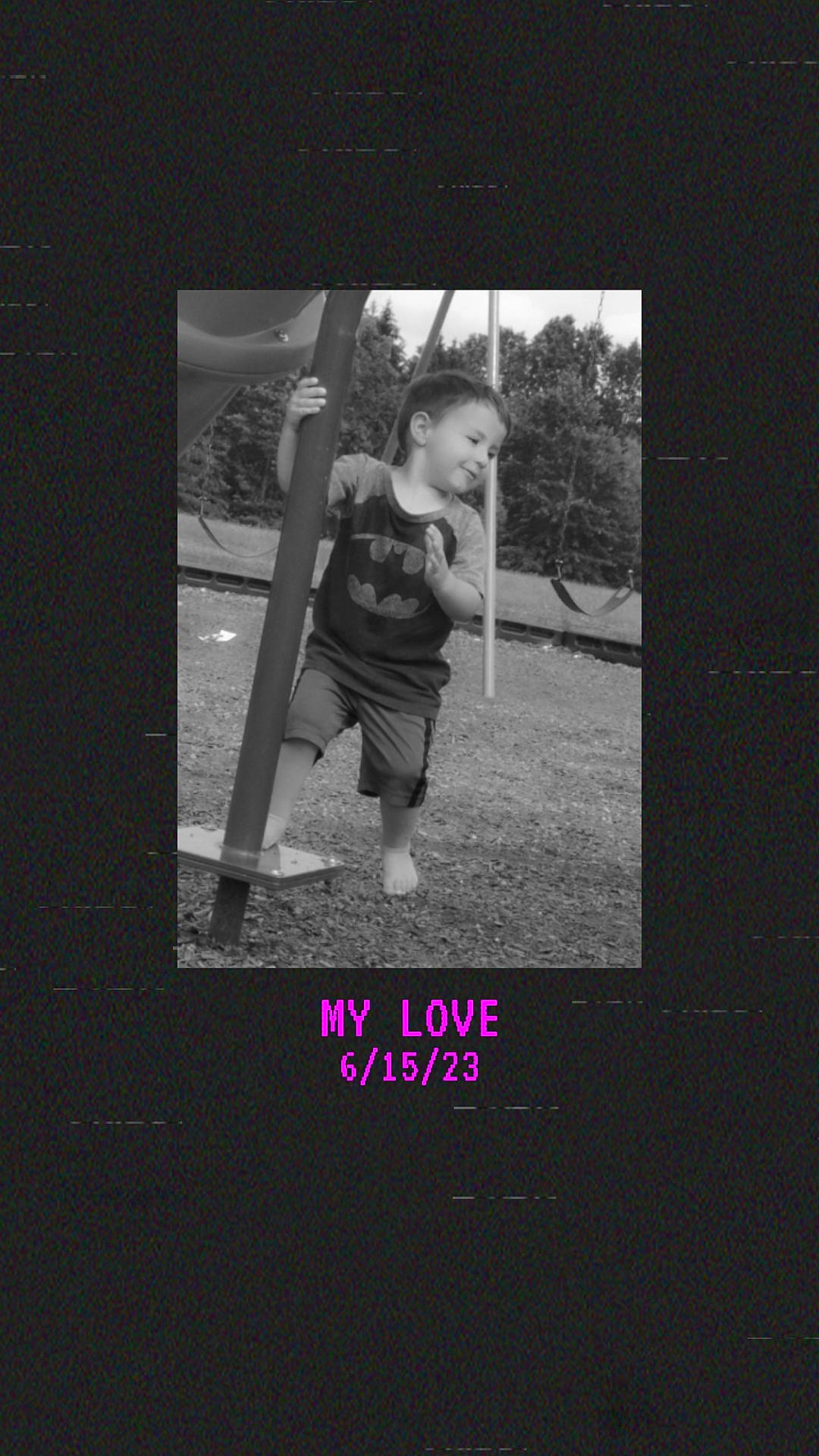 Ashton is registered to the contest to win money with this photo: advertising, darkness, flash_photography, font, gesture, grass, happy, joy, monochrome, monochrome_photography, person, photo_caption, picture_frame, plant, recreation, room, swing, t_shirt, tints_and_shades, toddler