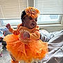 baby, child, orange, tutu, headband, window, blinds, indoor, person, clothing, cute, infant, socks, floor, carpet, hand, sleeve, face, expression, holding
