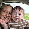 child, toddler, woman, smile, happy, face, portrait, indoor, car, window, nature, grass, sky, clothing, striped_shirt, person, hair, joy, family, parent