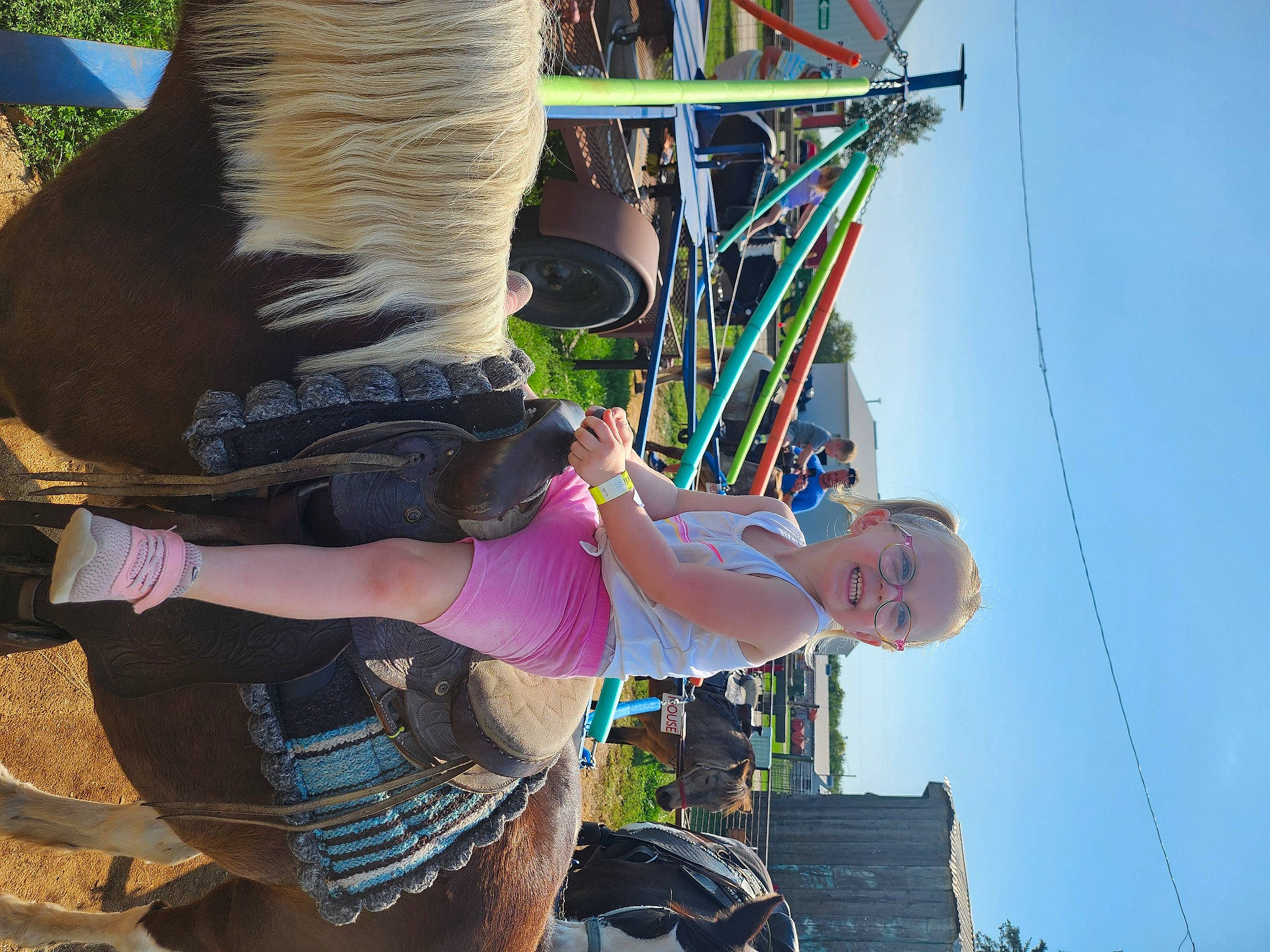 Mckenzie is registered to the contest to win money with this photo: elbow, event, eyewear, festival, fun, happy, human_leg, joy, leisure, person, recreation, shorts, sky, soil, thigh, travel, tree