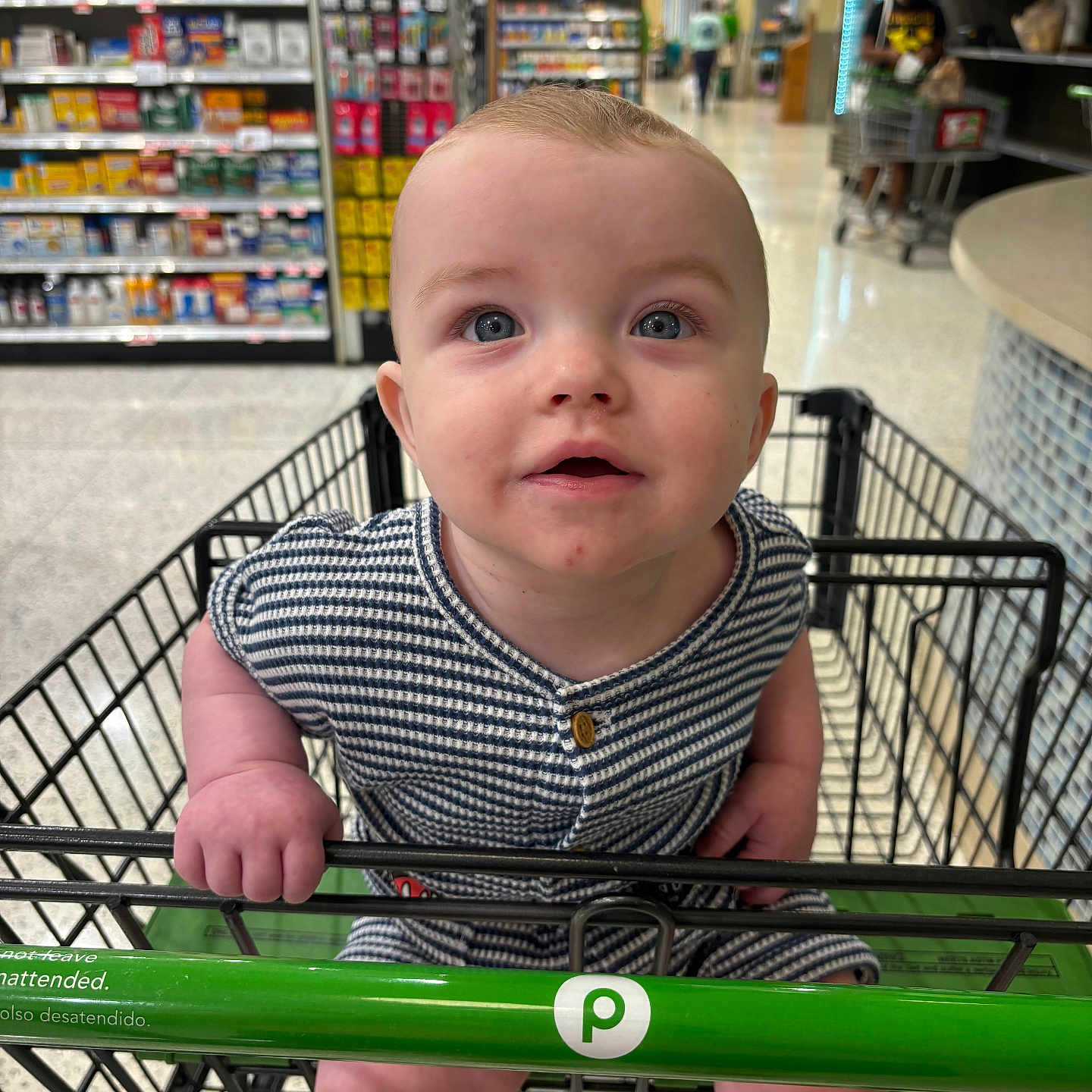 Oliver is registered to the contest to win money with this photo: accessories, adult, baby, bag, clothing, face, flag, grocerystore, handbag, head, indoors, male, man, person, photography, portrait, shelf, shop, shopping, shoppingcart
