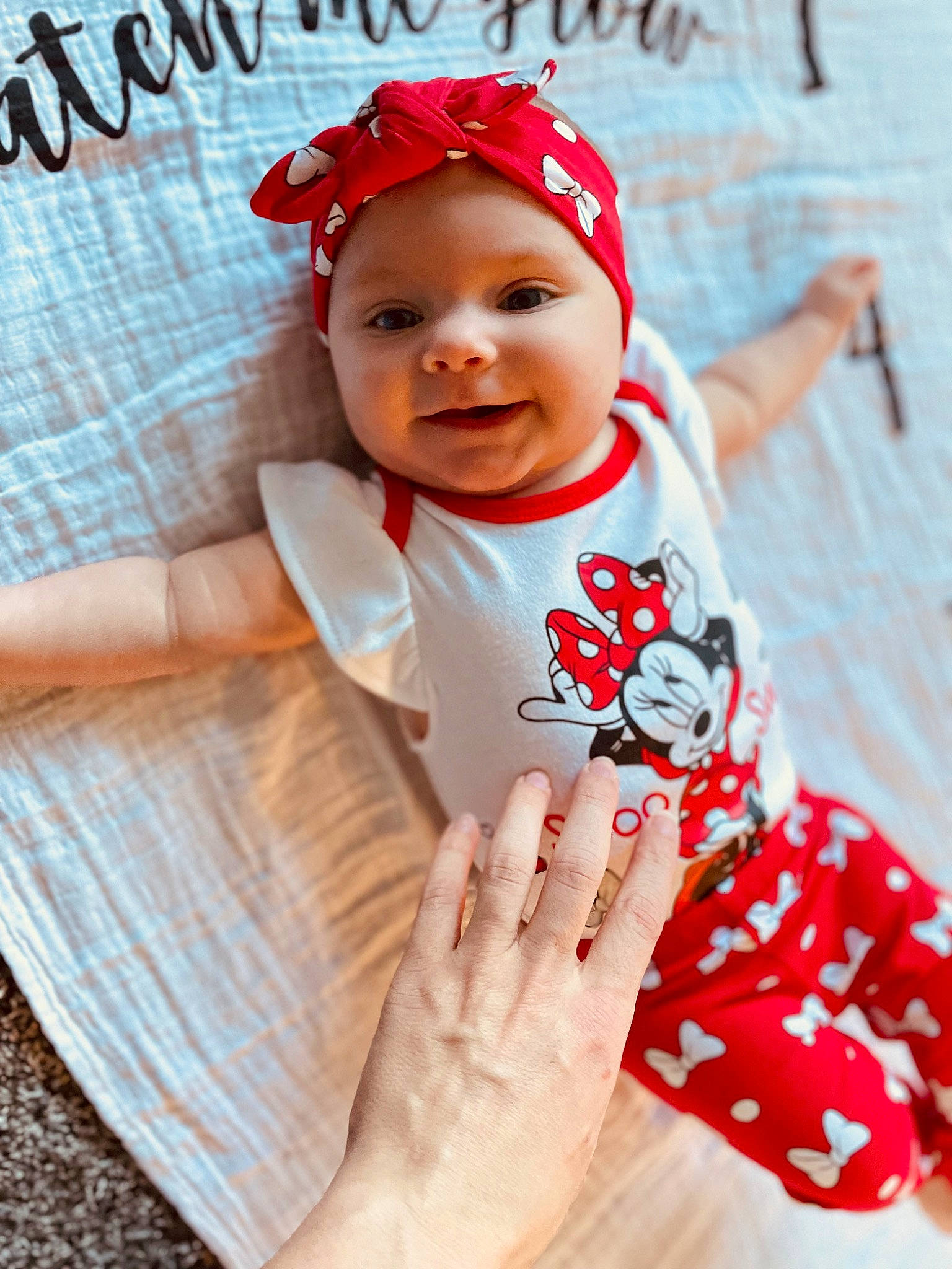 Lincoln is registered to the contest to win money with this photo: baby, baby_products, baby_toddler_clothing, cap, child, face, finger, gesture, happy, hat, headgear, headwear, lip, pattern, person, pink, skin, sleeve, smile, t_shirt