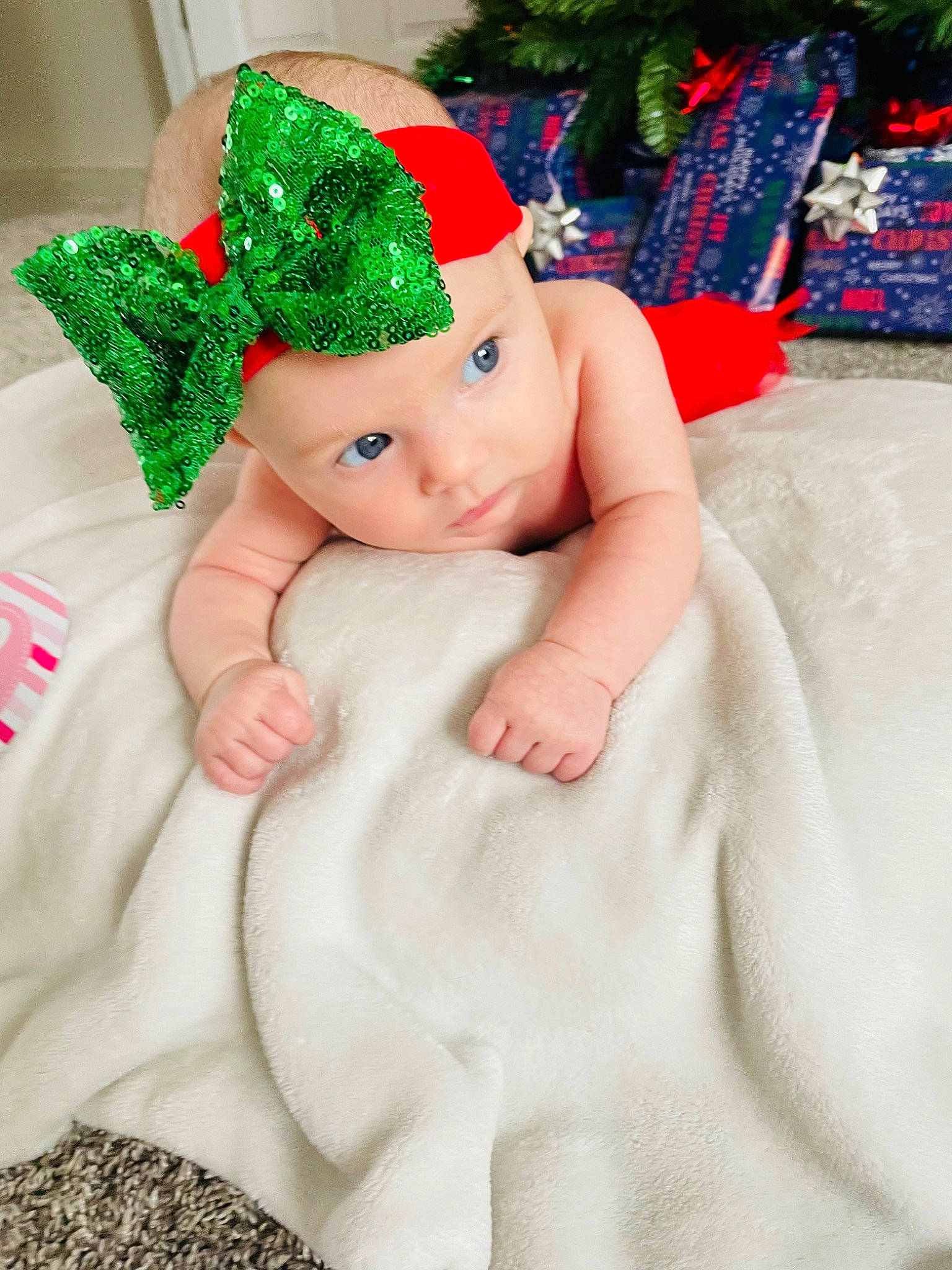 Lincoln is registered to the contest to win money with this photo: baby, baby_toddler_clothing, cap, carmine, christmas, christmas_eve, christmas_ornament, costume_hat, event, fashion_accessory, fictional_character, fur, happy, hat, headgear, headwear, holiday, linens, person, sleeve