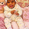 Sariyah joined the competition — help win amazing prizes! baby, child, infant, portrait, smiling, happy, sitting, headband, bow, onesie, pink, teddy_bear, crown, heart, flowers, blanket, plush, gift_boxes, nursery, indoor