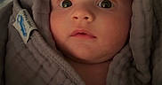 Joey joined the competition — help win amazing prizes! baby, infant, face, eyes, blanket, hood, wrapped, soft, cozy, expression, closeup, portrait, child, skin, cute, curious, indoors, warm, young, newborn