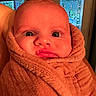 Joey joined the competition — help win amazing prizes! baby, face, child, towel, wrapped, indoor, expression, pout, skin, head, person, window, door, cozy, warm, closeup, infant, portrait, cute, funny_face