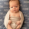 Phoenix is registered to the contest to win money with this photo: baby, infant, blanket, wrapped, cute, face, skin, newborn, lying_down, hands, legs, expression, texture, blue, beige, clothing, portrait, indoors, soft, peaceful
