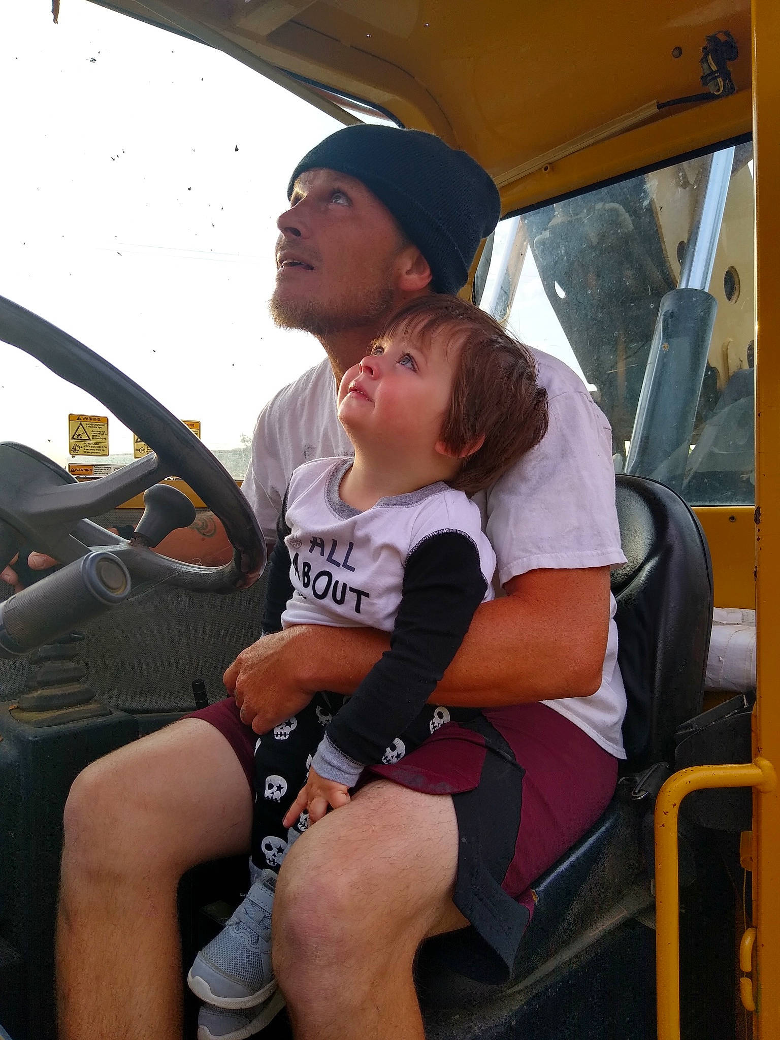 Cj is registered to the contest to win money with this photo: car, car_seat, headwear, leg, passenger, person, vehicle