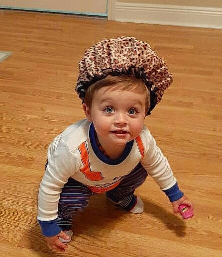 Cj is registered to the contest to win money with this photo: baby, cap, child, child_model, crawling, fashion_accessory, floor, flooring, hardwood, headgear, person, play, toddler, wood, wood_flooring